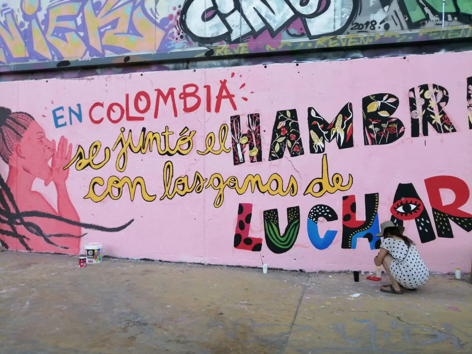 Mural comunitario pintado en Barcelona en el marco de una acción de Migress